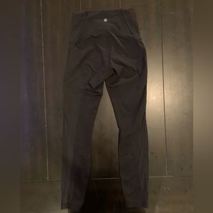 Size 4 black lulu leggings with mesh on the calf area